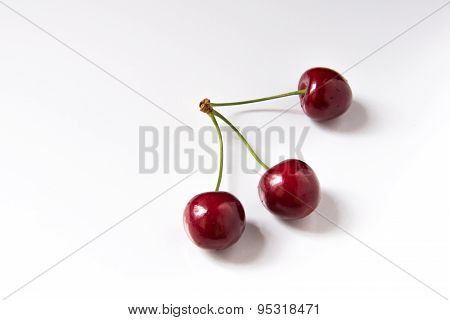 Bowl Of Red Fresh Cerries On A White Background
