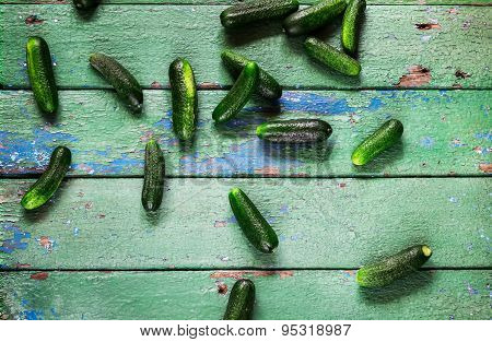 Cucumbers On Old Green  Wooden Table.