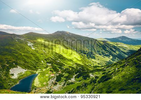Alpine lake Brebeneckul on summer mountain ravine (Ukraine, Chornogora Ridge, Carpathian Mountains).