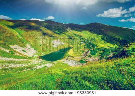Alpine lake Brebeneckul on summer mountain ravine (Ukraine, Chornogora Ridge, Carpathian Mountains).