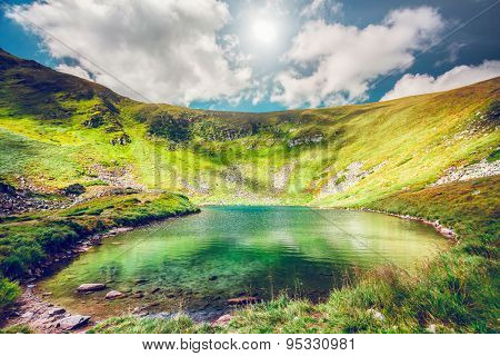Alpine lake Brebeneckul on summer mountain ravine (Ukraine, Chornogora Ridge, Carpathian Mountains).