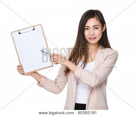 Young businesswoman pen point to clipboard with blank papera