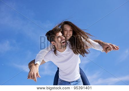 happy young romantic couple have fun relax smile at modern home outdoor terace balcony terace