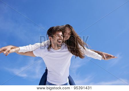 happy young romantic couple have fun relax smile at modern home outdoor terace balcony terace