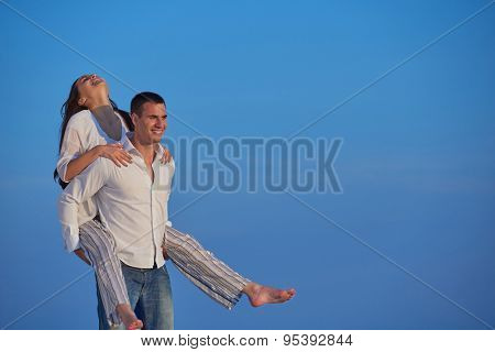 happy young romantic couple have fun relax smile at modern home outdoor terace balcony terace