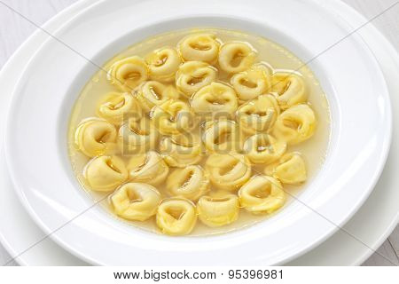 tortellini in brodo, ring shaped pasta in broth, italian emilia romagna soup cuisine