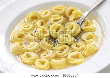 tortellini in brodo, ring shaped pasta in broth, italian emilia romagna soup cuisine