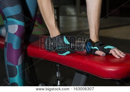 Young Woman Goes In For Sports At Gym