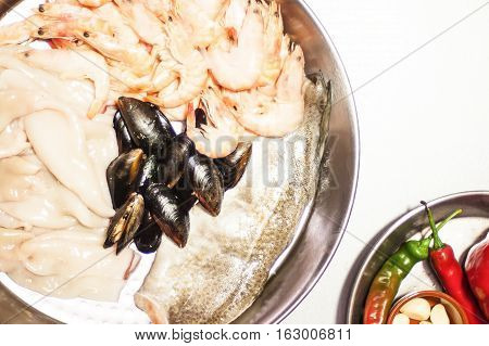 Italian pasta fideua with seafood, oysters, black pasta