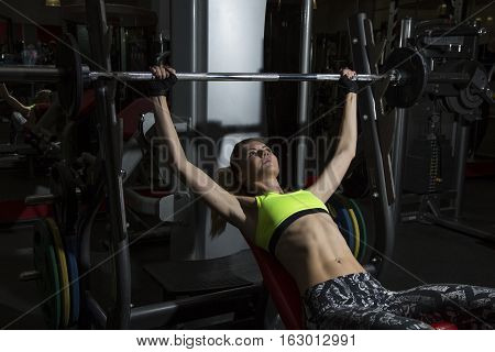 Young Woman Goes In For Sports At Gym