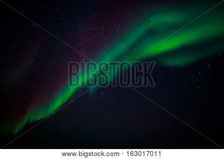 Green Northern Lights And A Starlight Sky Over Nuuk City, Greenland