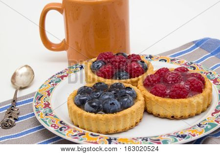 Delicious little fruit tarts to the coffee