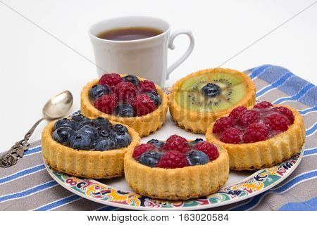 Delicious little fruit tarts to the coffee
