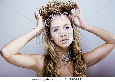 beauty young snow queen with hair crown on her head, complicate hairstyle, winter concept close up