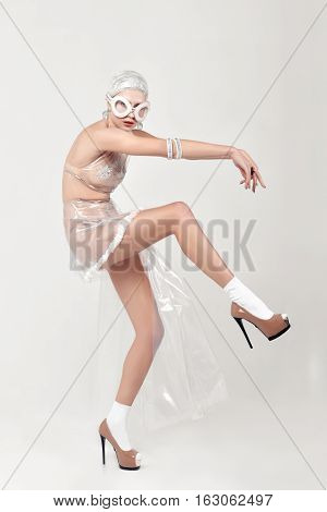 Woman Moves Unnaturally. She Is Dressed In An Unnatural Clothes
