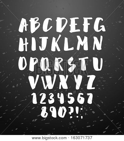 Vector alphabet. Hand drawn letters. Letters of the alphabet written with brush. Calligraphy white letters on black chalkboard background. Vector illustration stock vector.