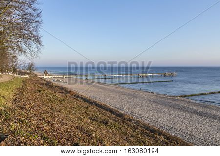 Beach Landscape With Pier At Koserow