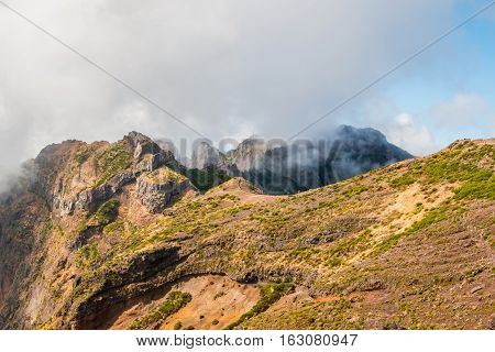 Hiker admiring Pico do Arierio, Pico Ruivo, Madeira, Portugal Europe