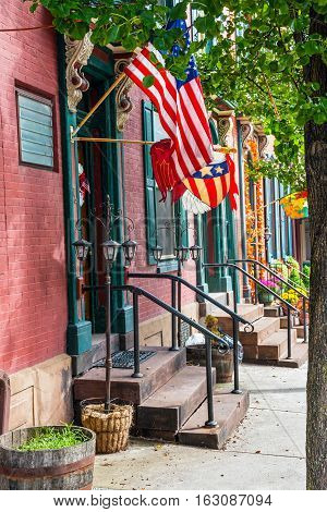 Old row homes with flags in historic Jim Thorpe Pennsylvania.