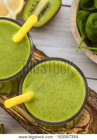 Fresh and healthy green smoothie with spinach,banana and kiwi. Vegetarian breakfasts. Picture with space for text or logos.