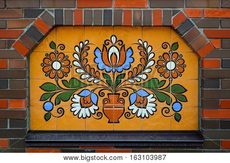 Ethnic ceramic decoration on the wall. Opishnya Poltavska oblast Ukraine.