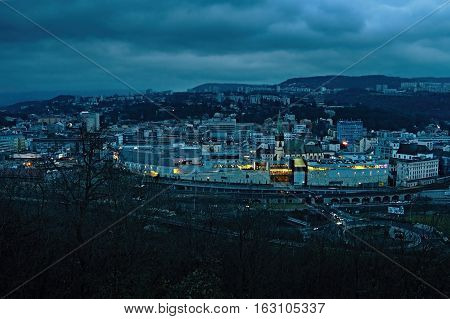 Usti nad Labem Ustecky kraj Czech republic - November 20 2016: evening view from Vetruse castle to Usti nad Labem city with shopping centre Forum and kostel Nanebevzeti P. Marie church