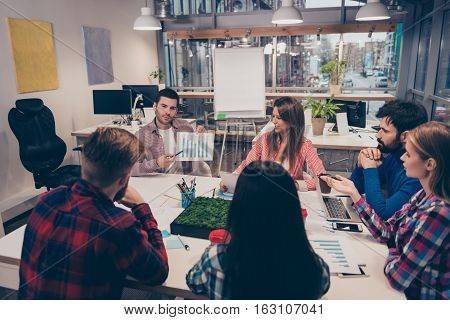 Speaker On Financial Seminar Showing Diagrama To His Colleagues