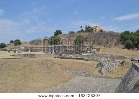 Church and Ruins. Our Lady of the Remedies church stands on the top of what looks like an ordinary hill but is really the Great pyramid of Cholula, Puebla Mexico