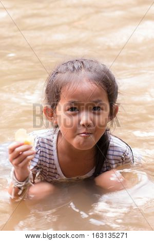 asia girl in river , thai children