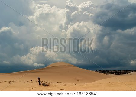 Dunes and white blue cumulus clouds Vietnam
