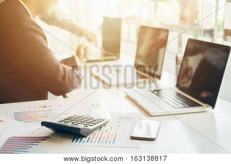 businessman working plan the business and analysis many chart graph. Film effected photo.