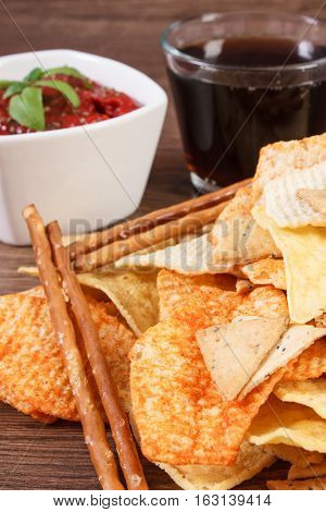 Heap Of Unhealthy Food, Sauce With Basil And Cola On Wooden Board