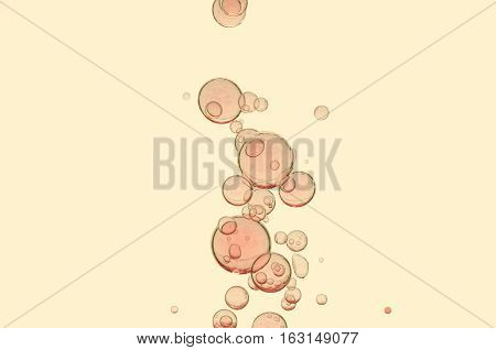 Air bubbles flows over a light yellow background