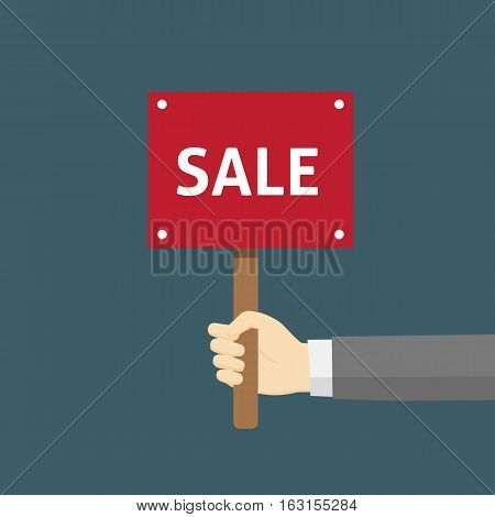 Hand Holding A Placard With Sale Sign