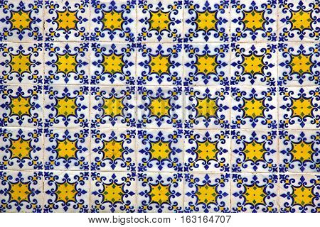 Typical Portuguese old ceramic wall tiles (Azulejos) on the building exterior Portugal. Seamless Azulejos pattern can be used for wallpaper pattern fills webpage background surface textures