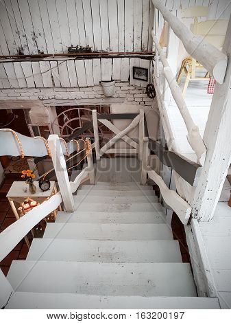 Stairs in old wooden restaurant. Vintage interior