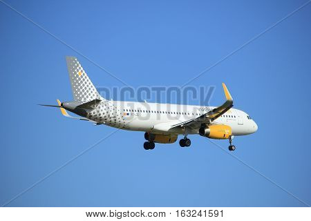 Amsterdam the Netherlands - July 15th 2016: EC-LZE Vueling Airbus A320 approaching Polderbaan runway at Schiphol Amsterdam Airport arriving from Barcelona Spain