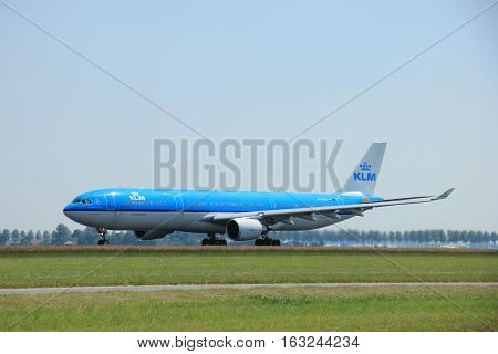Amsterdam The Netherlands - June 12 2015: PH-AKA KLM Royal Dutch Airlines Airbus A330-300 takes of from Amsterdam Airport Polderbaan runway.