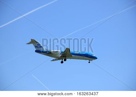 Amsterdam the Netherlands - May 5th 2016: PH-KZS KLM Cityhopper Fokker F70 approaching Schiphol Polderbaan runway arriving from Bremen Germany