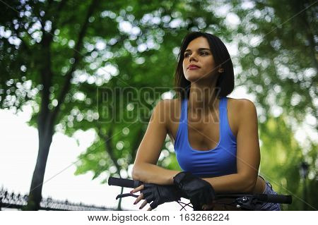 beautiful girl with bike resting before the trip
