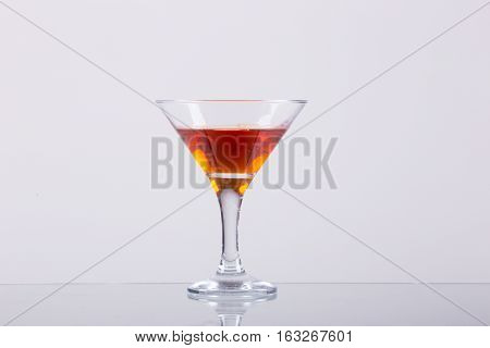 Cold alcoholic cocktail on the white background