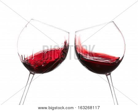 Red Wine Swirling In A Goblet Wine Glass, Isolated On A White Background