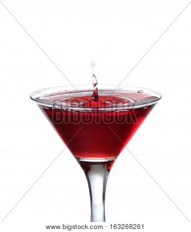 A Martini Glass On A White Background; The Water Ripples And Splashed As A Green Spanish Olive With