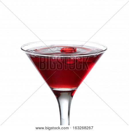 A Martini Glass On A White Background; The Water Ripples And Splashed As A Green Spanish Olive With