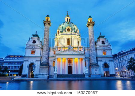 Night View Of Famous Saint Charles's Church At Karlsplatz In Vienna, Austria