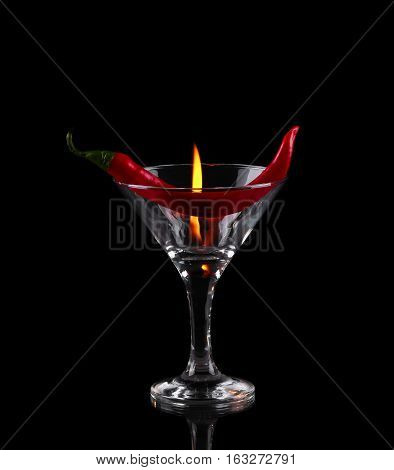 Hot Chili Pepper In A Martini Glass With A Fire On A Black Background