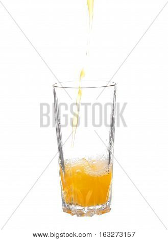 Pouring Orange Juice Into The Glass Isolated On White