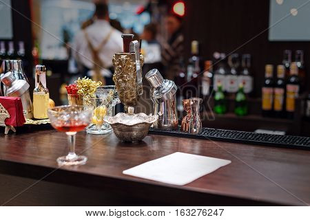 Set of bar accessories and ingredients for making a cocktails on counter
