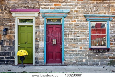 JIM THORPE PENNSYLVANIA - SEPTEMBER 28: Colorful historic stone row homes exteriors on September 28 2016 in Jim Thorpe Pennsylvania.