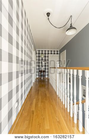 Spacious Corridor With Wooden Staircase